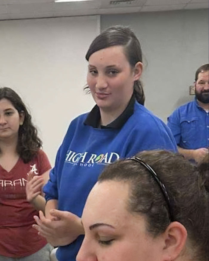 Group of teens and adults indoors, related to news about two teens charged with homicide after brutal attack on 14YO girl.