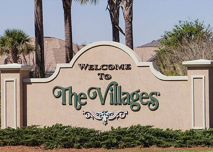 Entrance sign of The Villages community with palm trees in the background, related to child kidnapped from Kentucky case. Entrance sign of The Villages community with palm trees in the background, related to child kidnapped from Kentucky case.