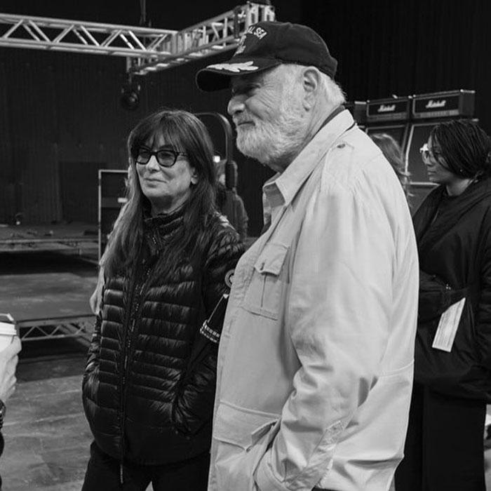 Rob Reiner and a woman standing indoors near stage equipment, related to news about Rob Reiner&rsquo;s son arrested case.