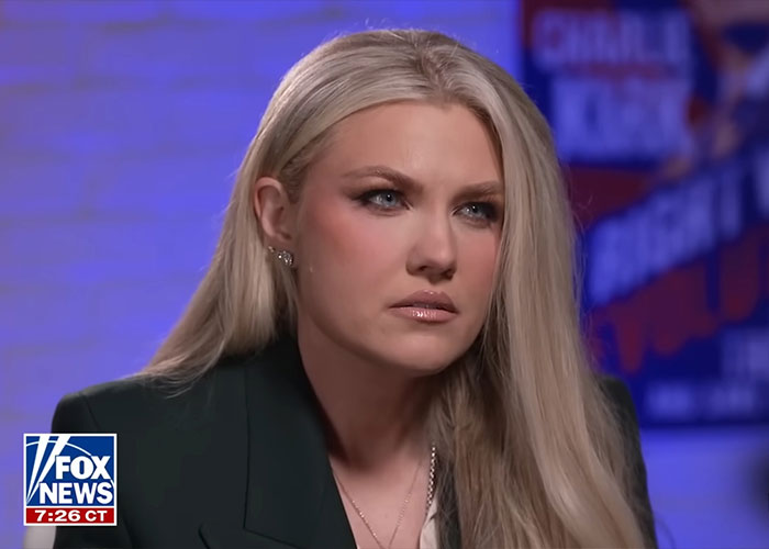 Erika Kirk in an interview setting with focused expression discussing husband Charlie's body slam as clip resurfaces. Erika Kirk in an interview setting with focused expression discussing husband Charlie's body slam as clip resurfaces.