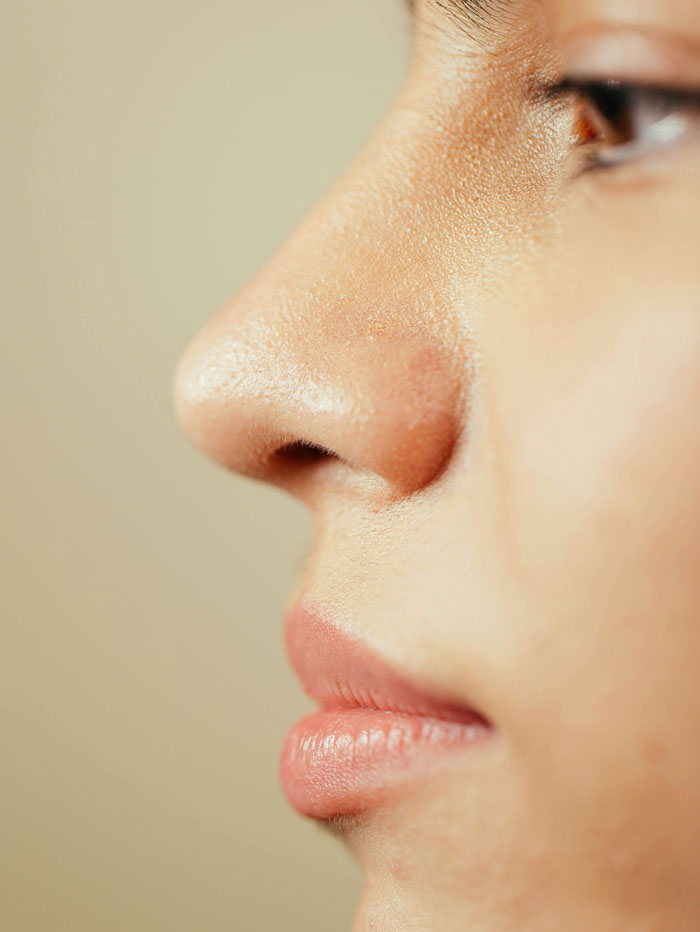 Close-up of a child’s face showing detailed skin texture and lips, highlighting little kids with spicy roasts expression.