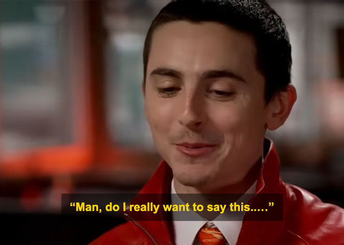 Timoth&eacute;e Chalamet in a red jacket during an interview, facing backlash over perceived arrogance and criticism.