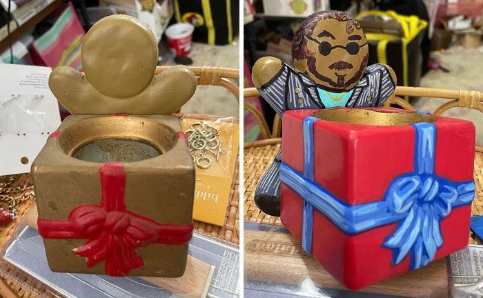 Personalized thrifted painting of a gift box with added humorous figure wearing sunglasses and striped suit.