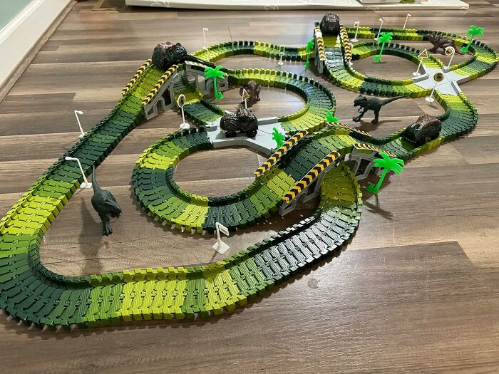 A Dinosaur World Racetrack Will Turn Your Living Room From A Regular, Boring Space Into A Prehistoric, High-Octane Raceway Where The Only Thing More Dangerous Than The Hairpin Turns Are The Tiny, Plastic Dinosaurs