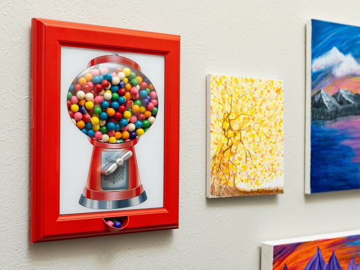 Framed gumball machine art filled with colorful gumballs, displayed as a unique never-before-seen gift idea.