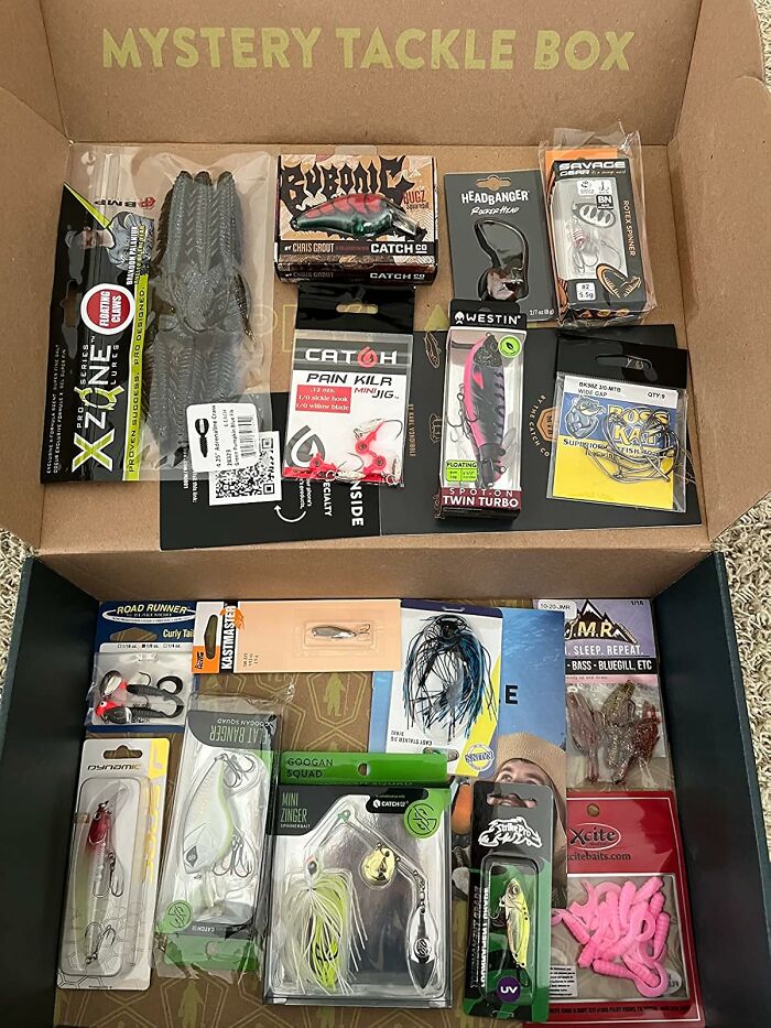 Mystery tackle box filled with various fishing lures and gear, a popular blind box for Christmas morning surprises.