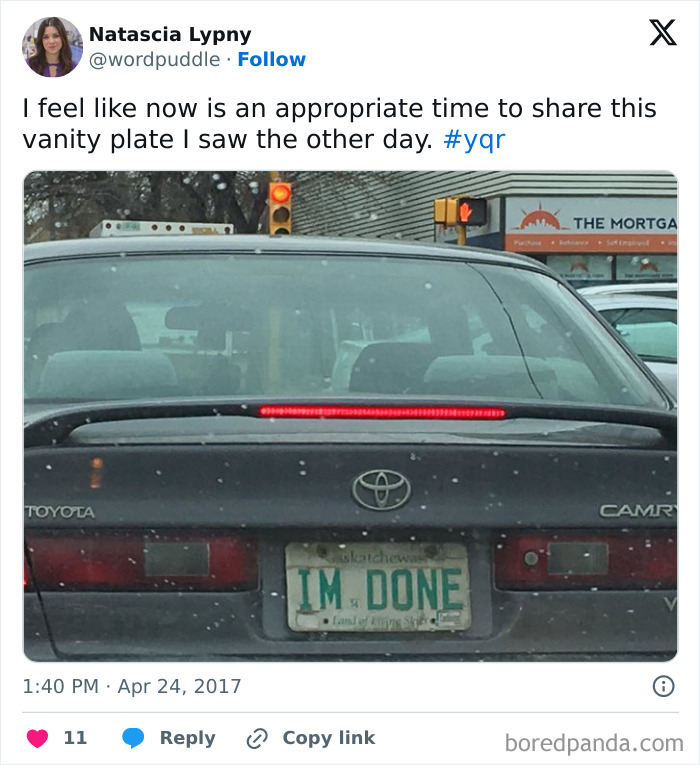 Black Toyota Camry with a hilarious personalized license plate reading IM DONE, causing strangers to do double takes.