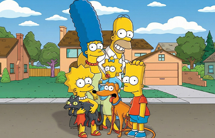 The Simpsons family standing outside their home with pets, representing one of the longest running TV shows.