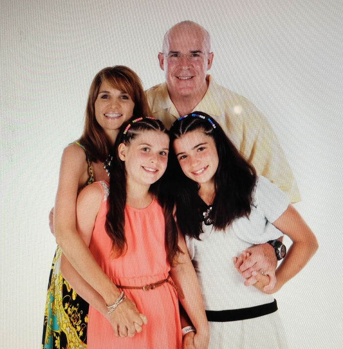 Family portrait of four smiling members in a bright setting, related to sorority girl tragic Christmas Eve accident news. Family portrait of four smiling members in a bright setting, related to sorority girl tragic Christmas Eve accident news.