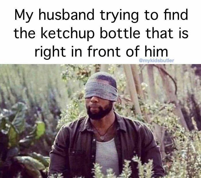 Man blindfolded humorously searching, illustrating a funny and savage parenting meme about everyday challenges with kids.