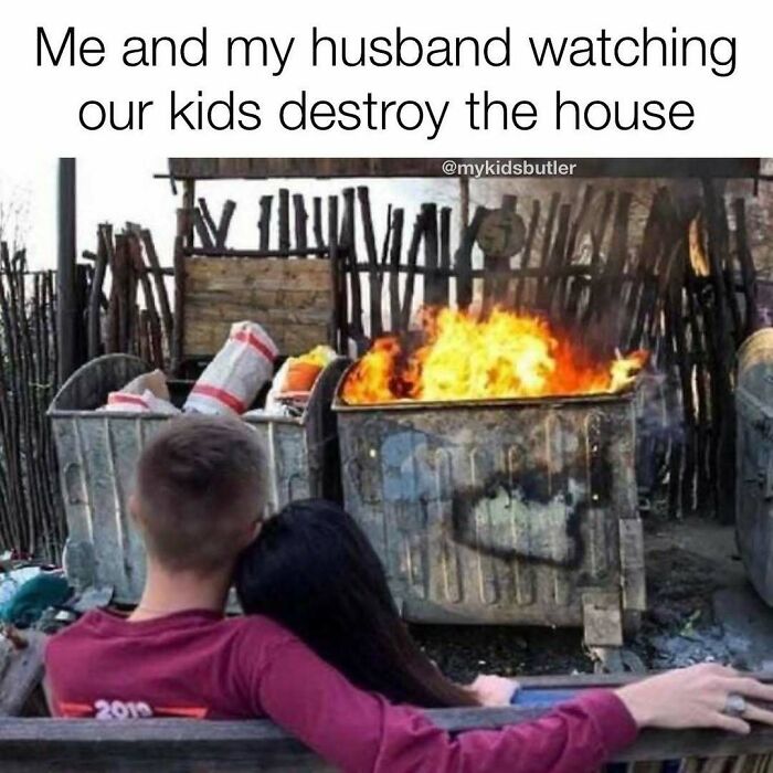 Couple watching a dumpster fire representing kids destroying the house in funny and savage parenting memes.