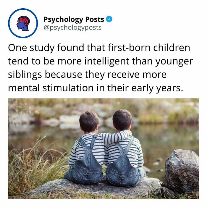 Psychology facts about intelligence showing two children sitting together by a lakeside with one arm around the other.
