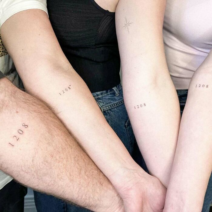 Four matching wholesome tattoos of the number 1208 on different arms showing meaningful ink designs.