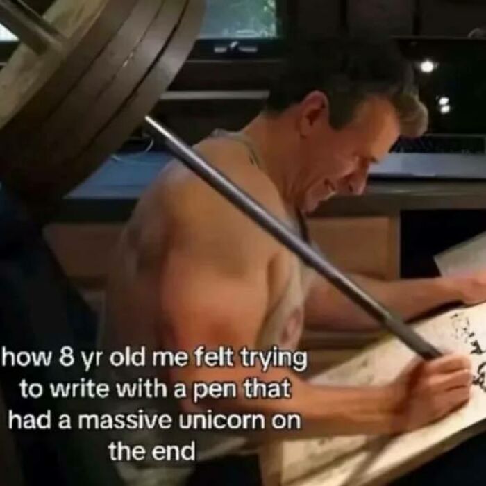 Man struggling to lift heavy weight while writing, humorous meme illustrating effort related to Know Your Meme content.