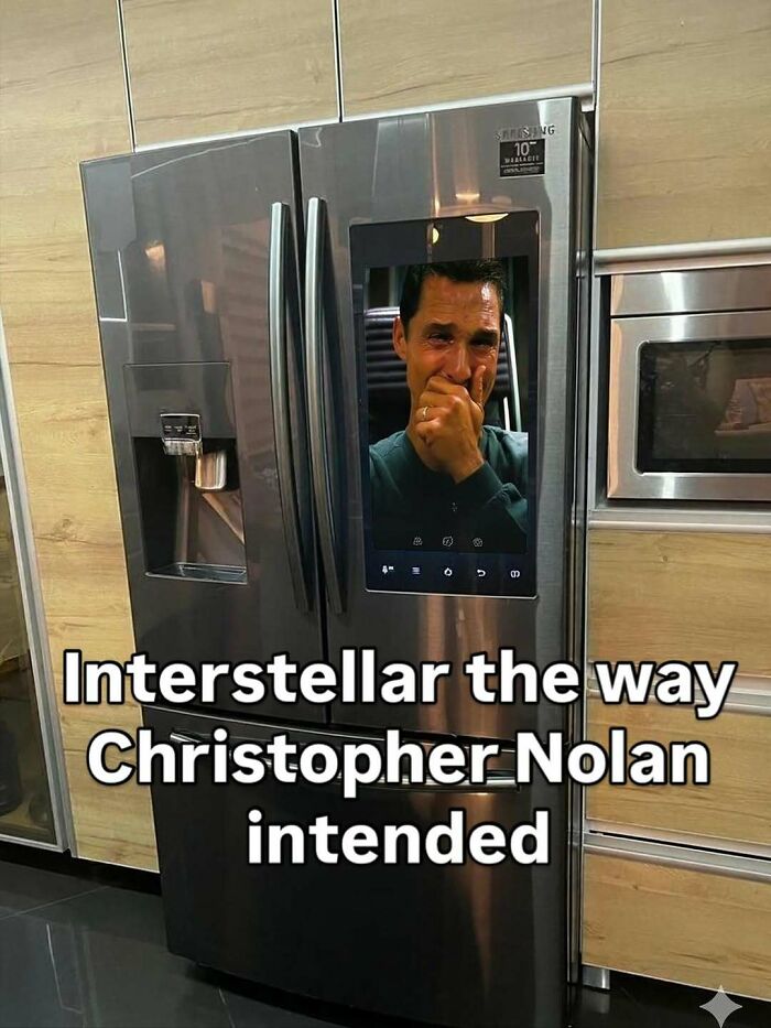 Stainless steel dude fridge with digital screen showing a crying man, a wild example of dude fridges design and humor.