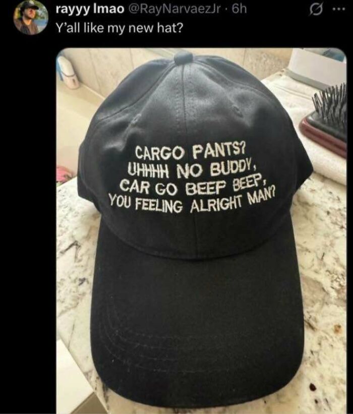 Black hat with funny meme text about cargo pants and car sounds, shared in a Know Your Meme post on social media.