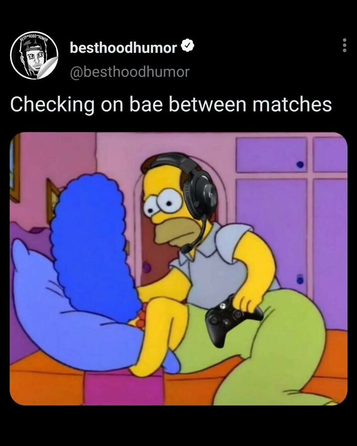 Homer Simpson wearing a gaming headset, holding a controller, leaning on Marge’s blue hair in a funny meme about checking on bae.