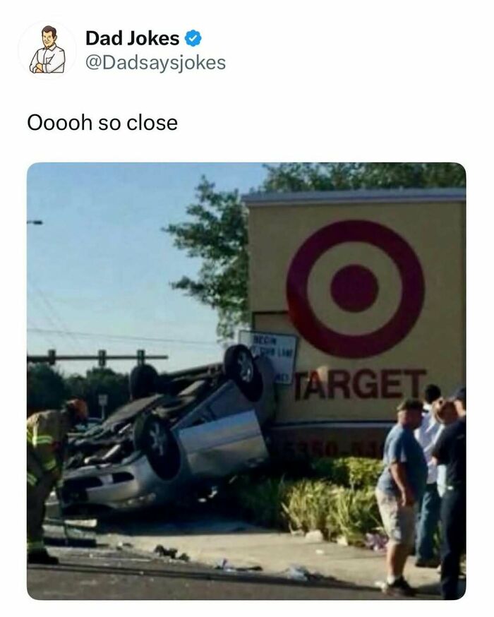 Car flipped upside down near a Target store sign with bystanders and a firefighter, illustrating a funny dad joke scene.