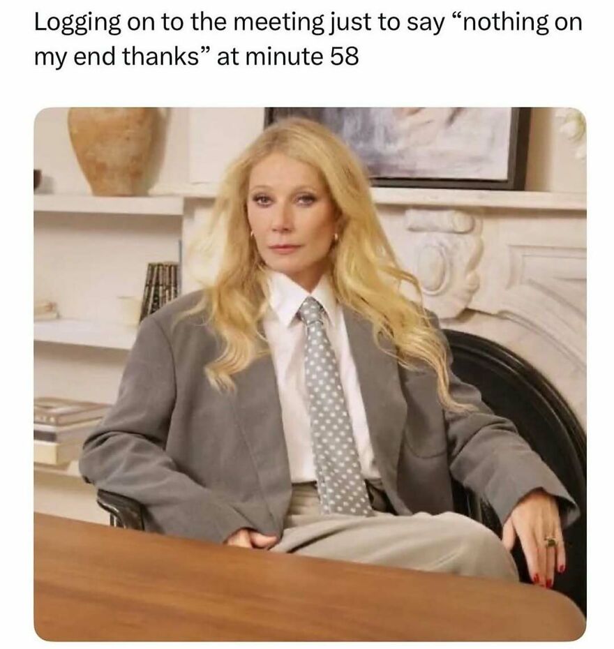 Woman in oversized suit sitting at table with caption about logging on to meeting, related to therapist memes to share.