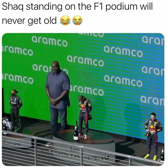 Shaquille O'Neal photoshopped towering over F1 podium, humorous meme combining sports and comedy for meme fans.