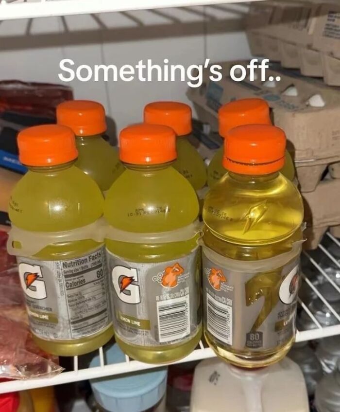 Six bottles of lemon lime Gatorade in a fridge with one bottle filled with yellow liquid and text saying something’s off dude fridges.