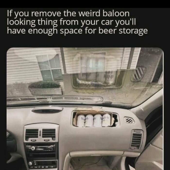 Car dashboard with a removed airbag compartment used for beer storage, a humorous meme to handle reality with humor.