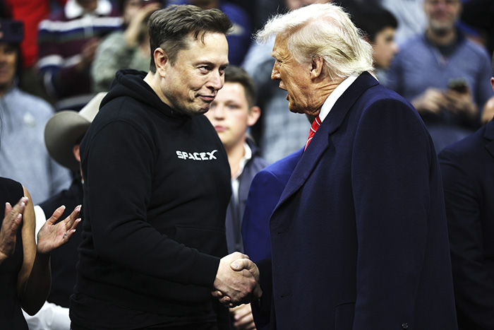 Elon Musk in a black SpaceX hoodie shaking hands with a man in a dark coat amid a crowd, highlighting tragic mental illness discussion. Elon Musk in a black SpaceX hoodie shaking hands with a man in a dark coat amid a crowd, highlighting tragic mental illness discussion.