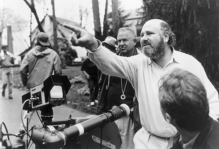 Rob Reiner directing on set, discussing scenes with crew in an outdoor film production environment. Rob Reiner directing on set, discussing scenes with crew in an outdoor film production environment.