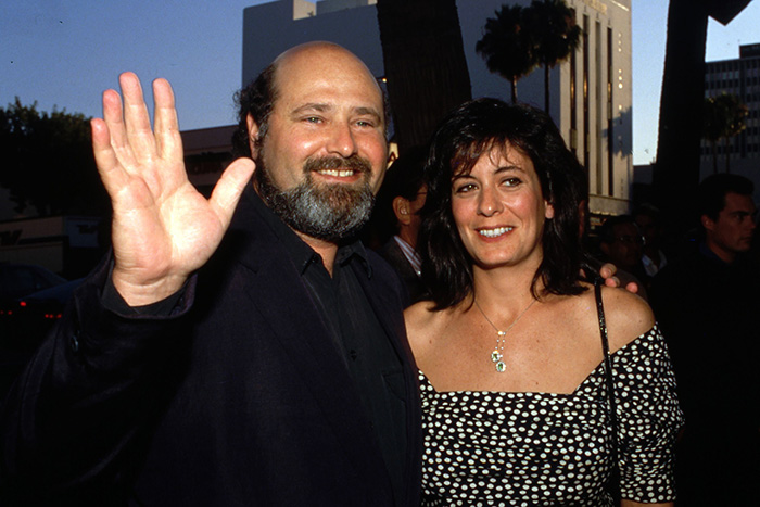 Rob Reiner with a woman at an outdoor event, showcasing Hollywood icon discussions and close friendship moments. Rob Reiner with a woman at an outdoor event, showcasing Hollywood icon discussions and close friendship moments.