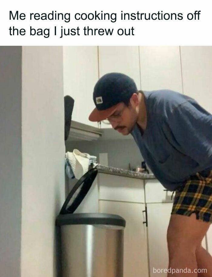 Man humorously reading cooking instructions from a trash can, illustrating relatable memes that have no reason to be this funny.