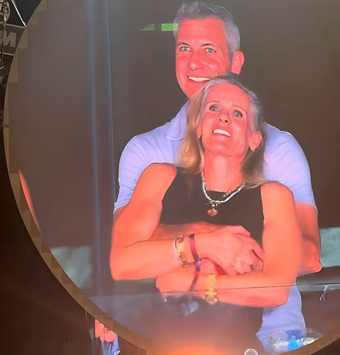 HR executive caught on Coldplay kiss cam embracing a woman at night, highlighting hypocrite controversy in public setting.