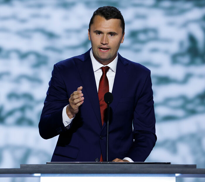 Man in blue suit and red tie speaking at a podium, related to MAGA hypocrisy debate and political commentary. Man in blue suit and red tie speaking at a podium, related to MAGA hypocrisy debate and political commentary.