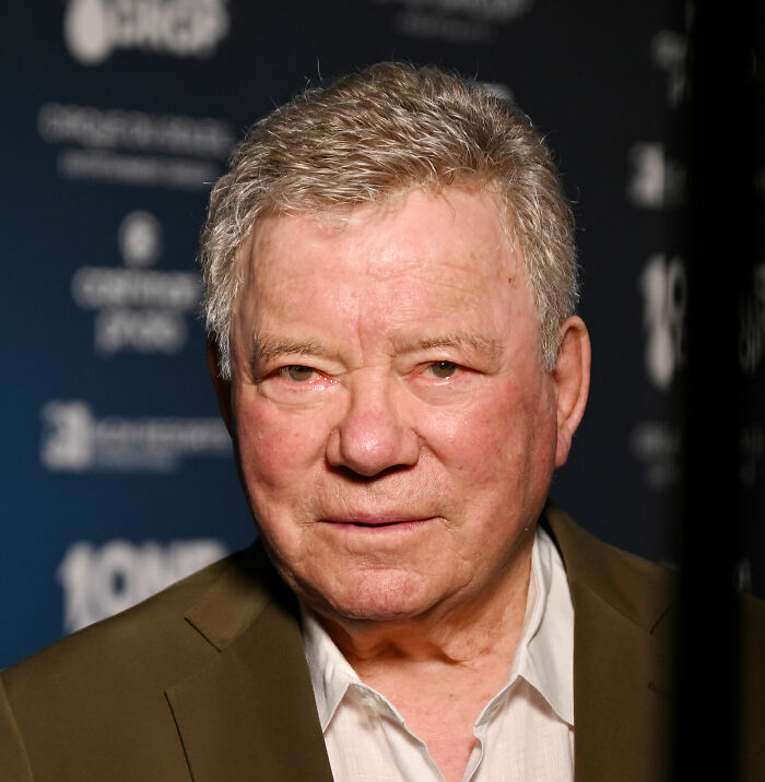 Older man in a brown jacket and white shirt at an event, related to banned stars from the Tonight Show by Johnny Carson. Older man in a brown jacket and white shirt at an event, related to banned stars from the Tonight Show by Johnny Carson.