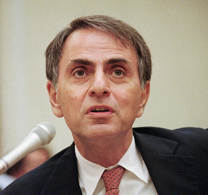 Man in suit speaking near microphone, representing banned stars from the Tonight Show by Johnny Carson exposed. Man in suit speaking near microphone, representing banned stars from the Tonight Show by Johnny Carson exposed.