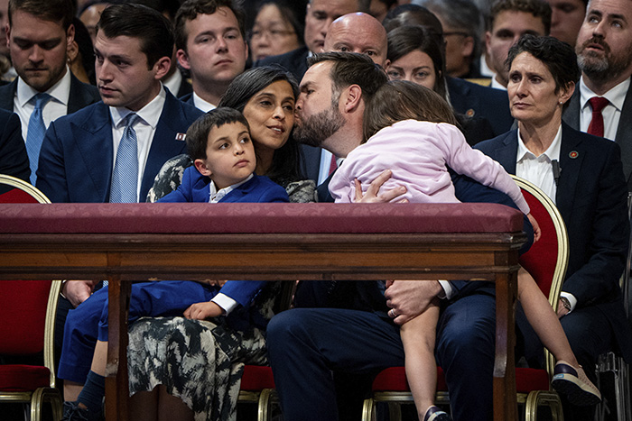 JD Vance&rsquo;s wife Usha and family sitting closely amid public speculation about their marriage at a formal event.