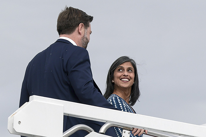 Usha Vance smiling at JD Vance while ascending stairs, highlighting public speculation about their marriage. Usha Vance smiling at JD Vance while ascending stairs, highlighting public speculation about their marriage.