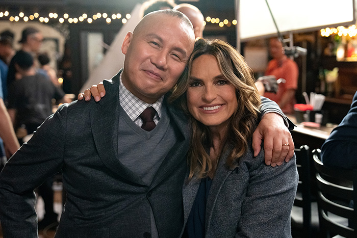 BD Wong and co-star smiling on set, related to Jurassic World star issuing groveling apology after racist comment. BD Wong and co-star smiling on set, related to Jurassic World star issuing groveling apology after racist comment.