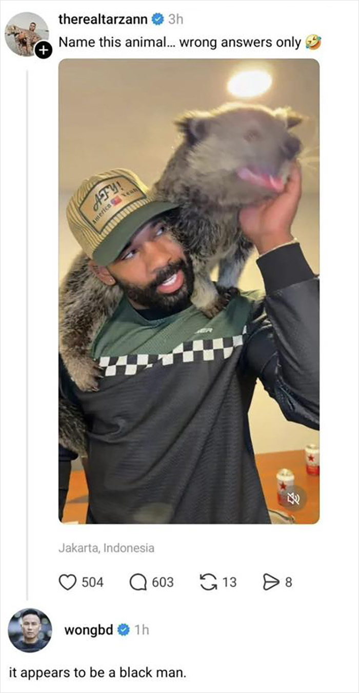 Man wearing cap with animal on shoulders, related to Jurassic World star BD Wong apology for racist comment controversy. Man wearing cap with animal on shoulders, related to Jurassic World star BD Wong apology for racist comment controversy.