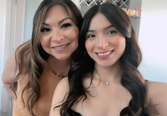 Mom of late cheerleader posing with young woman, showing emotion after cops found crucial clue on phone case