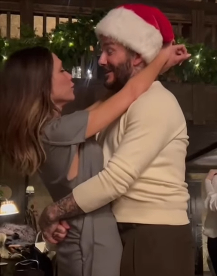 Nicola Peltz and Victoria share a festive moment with Christmas decorations in the background during holiday celebrations.