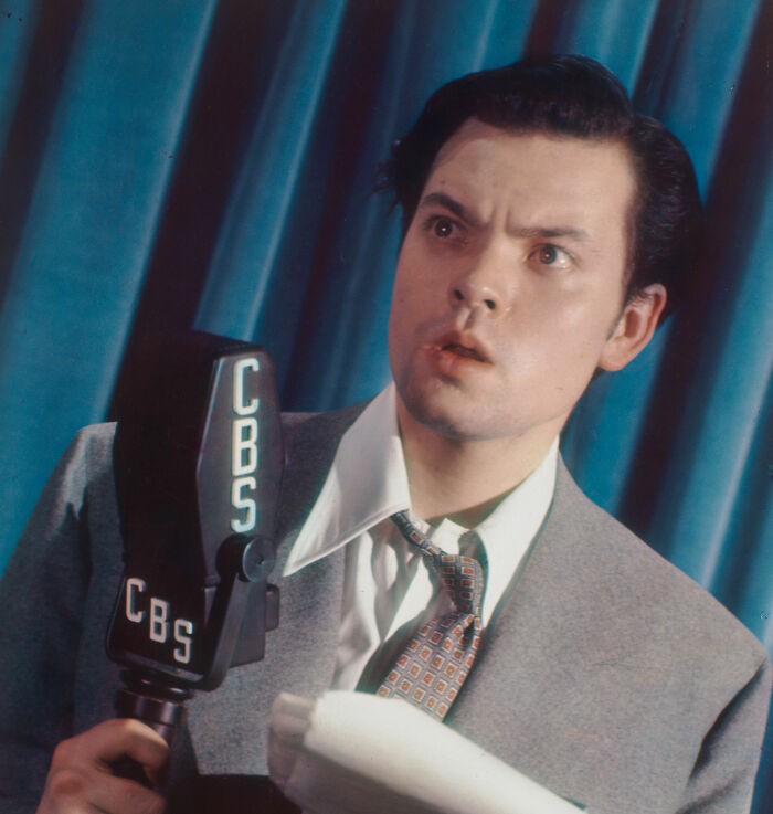 Young man in a suit holding a CBS microphone, representing banned stars from the Tonight Show by Johnny Carson. Young man in a suit holding a CBS microphone, representing banned stars from the Tonight Show by Johnny Carson.
