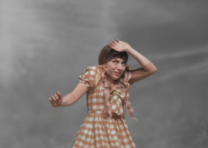 Actress in a yellow checkered dress reacting dramatically during a Wizard of Oz performance that outraged the audience. Actress in a yellow checkered dress reacting dramatically during a Wizard of Oz performance that outraged the audience.