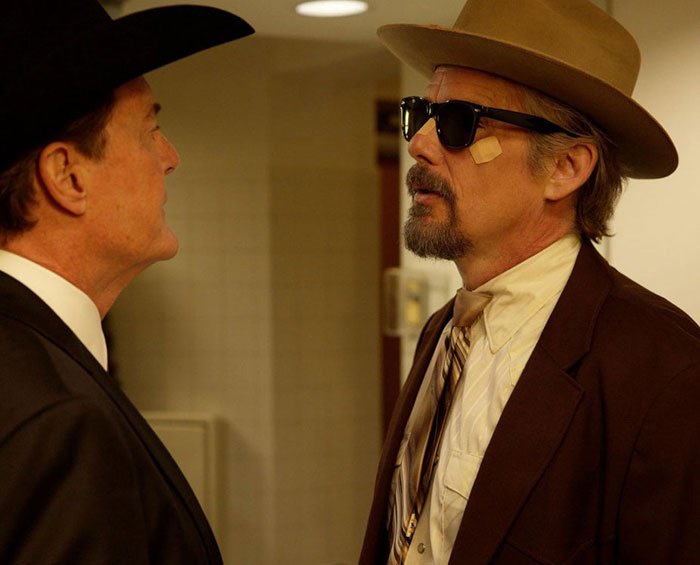 Ethan Hawke in vintage attire and sunglasses in an intense moment sparking online firestorm over pairing with Sydney Sweeney