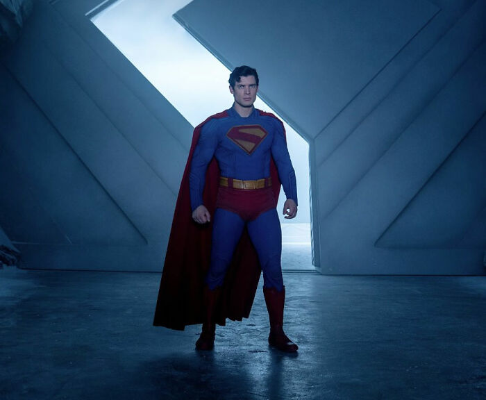 David Corenswet as Superman, standing in a futuristic setting, sparking outrage over masculinity perspectives.