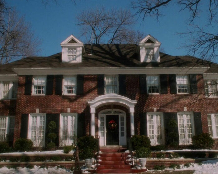 Classic red brick house from Home Alone, related to Macaulay Culkin and Kevin’s dad job theory discussion. Classic red brick house from Home Alone, related to Macaulay Culkin and Kevin’s dad job theory discussion.