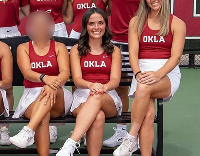 Group of female students in Oklahoma tennis uniforms sitting on a bench, concept representing student anonymously exposes essay details.