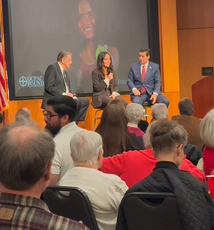 Panel discussion at event with audience, featuring speakers discussing student anonymously exposes essay details controversy Panel discussion at event with audience, featuring speakers discussing student anonymously exposes essay details controversy