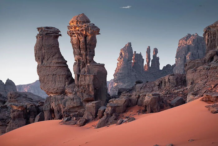 Tall rock formations in a desert landscape captured in stunning detail, showcasing best nature photography of 2025.