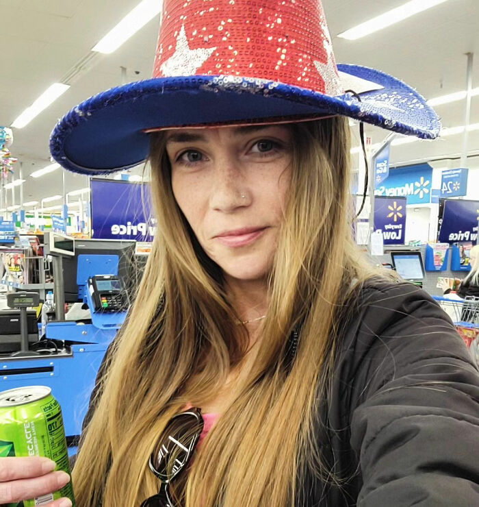 Woman wearing a red and blue sequined hat inside a store, related to Cinnabon worker's daughter and racist tirade. Woman wearing a red and blue sequined hat inside a store, related to Cinnabon worker's daughter and racist tirade.