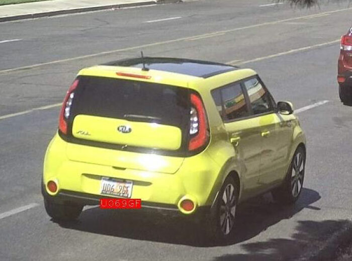 Rear view of a yellow Kia Soul car on a city street, related to trans Muslim woman’s fate after sentencing news. Rear view of a yellow Kia Soul car on a city street, related to trans Muslim woman’s fate after sentencing news.